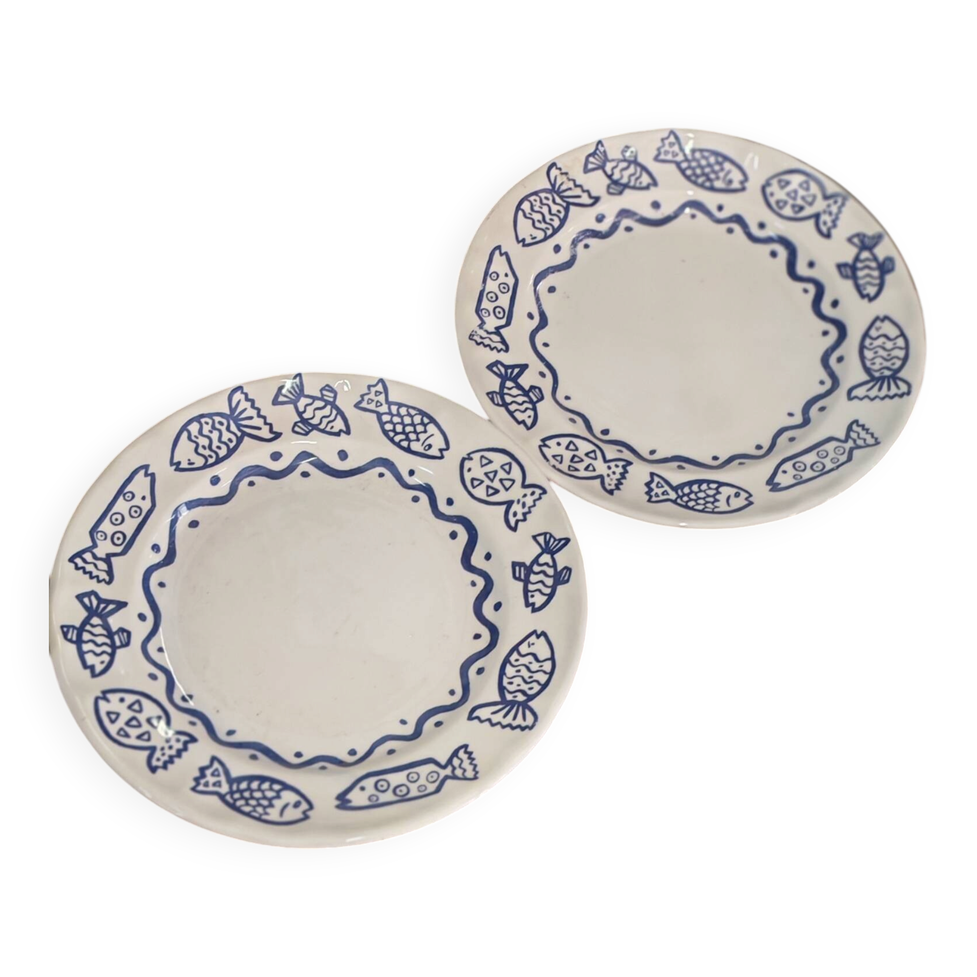 Pair of Castellania plates from Italy with blue fish decoration.