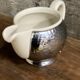 Ceramic/tinned milk jug.