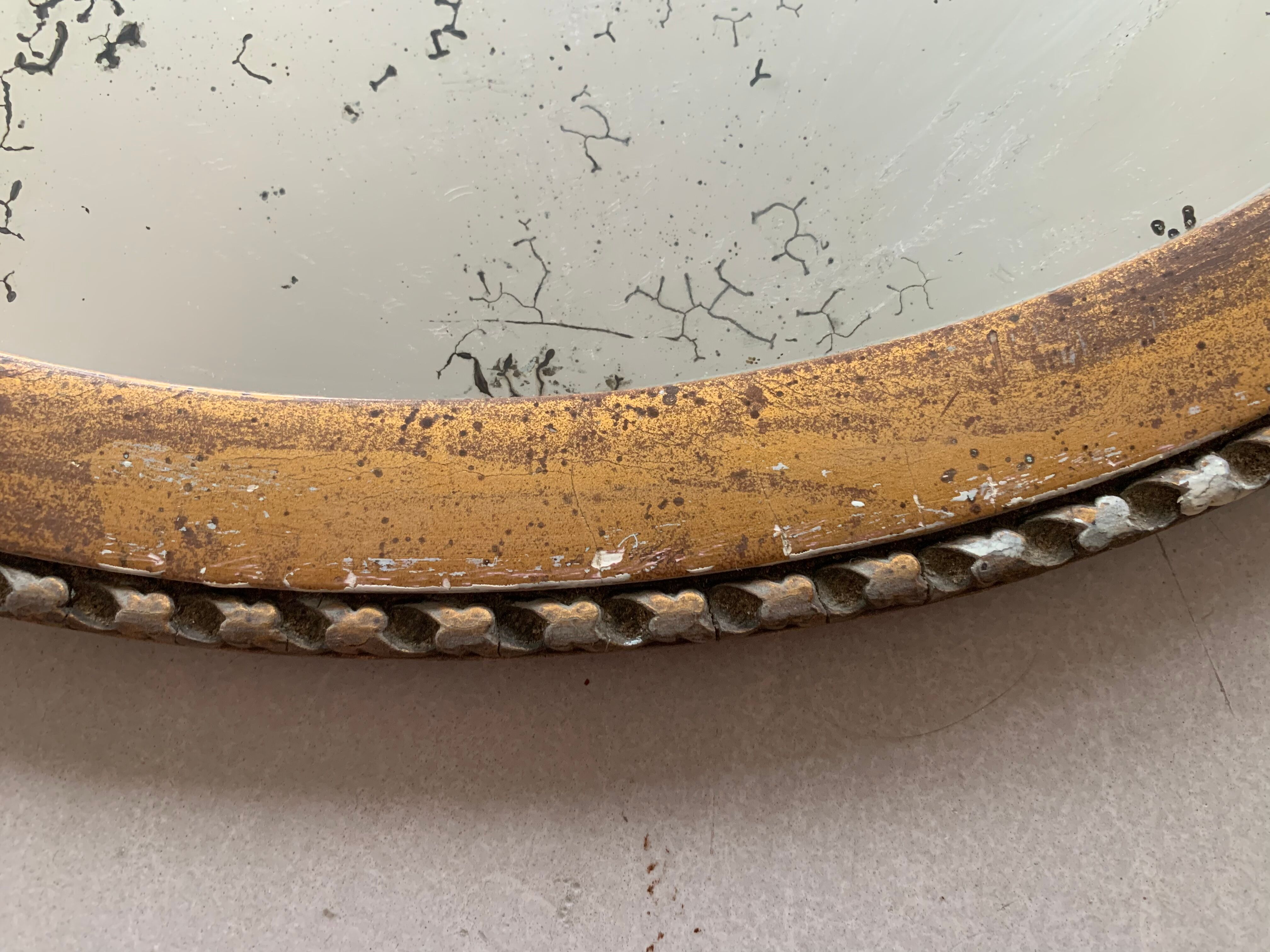 Old oval mirror stitched