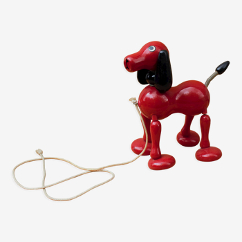 Vieux chien jouet en bois rouge retro