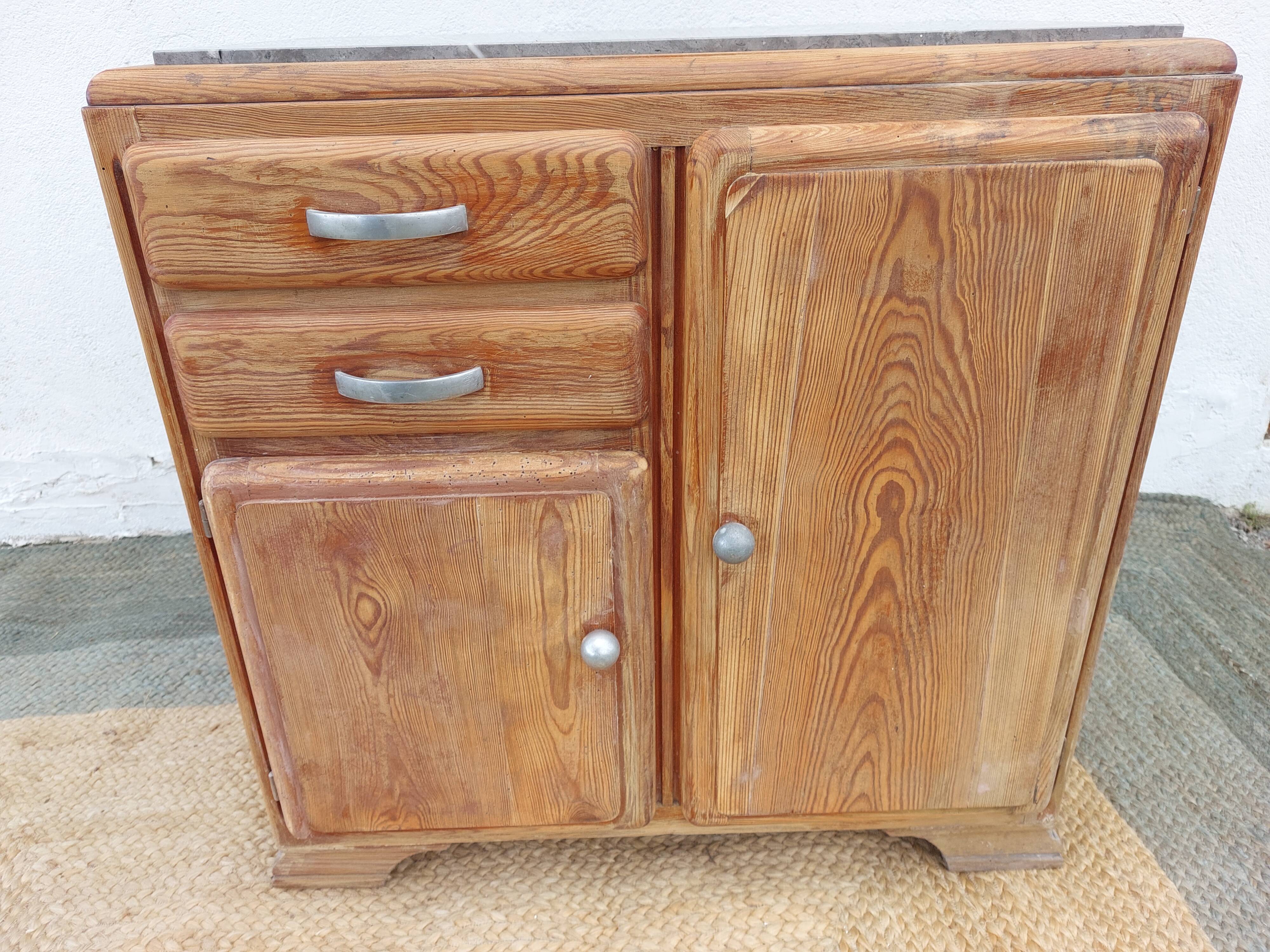 Vintage wooden buffet with a marble top.