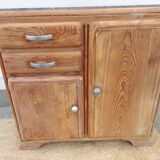 Vintage wooden buffet with a marble top.