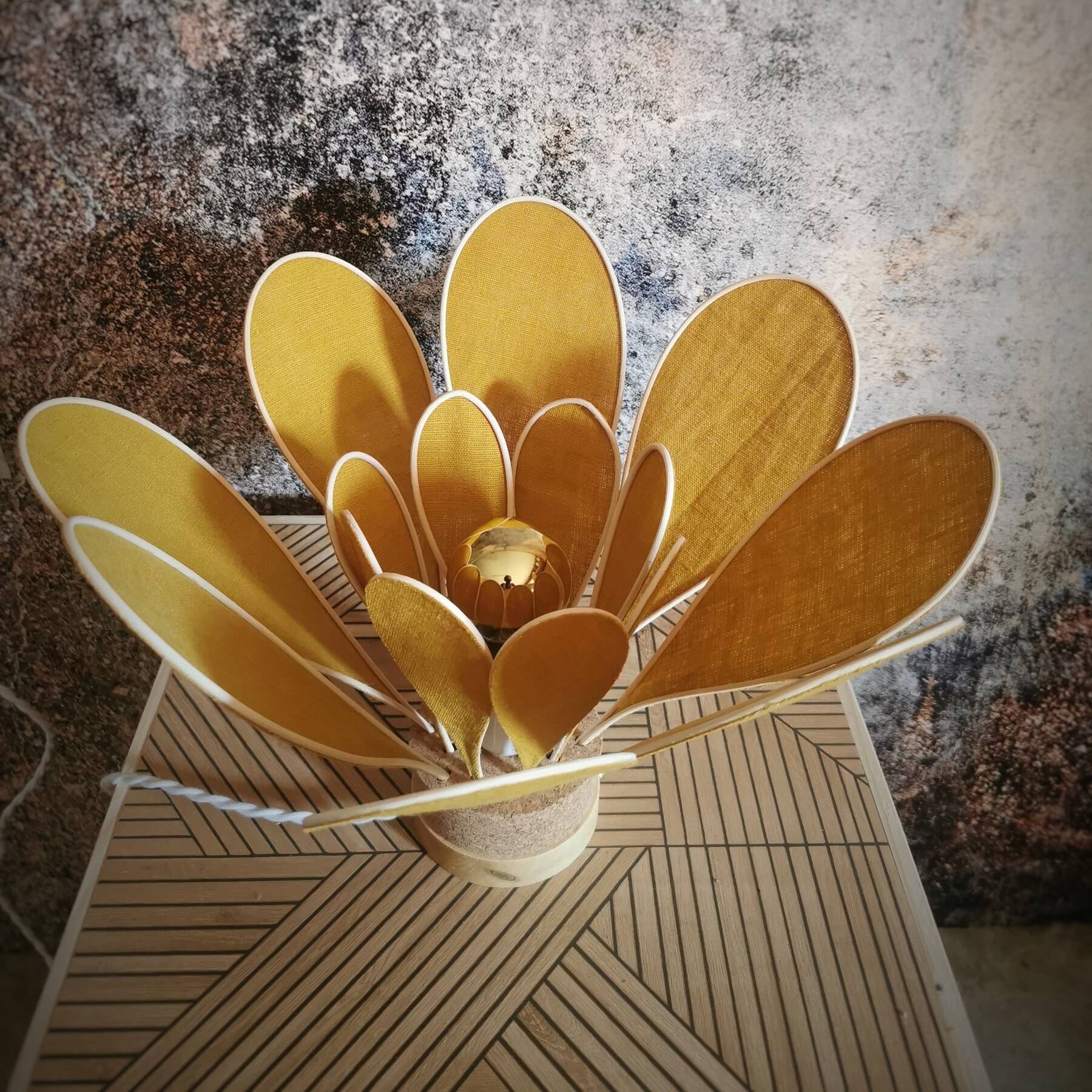 Flower table lamp made of rattan and saffron yellow linen petals