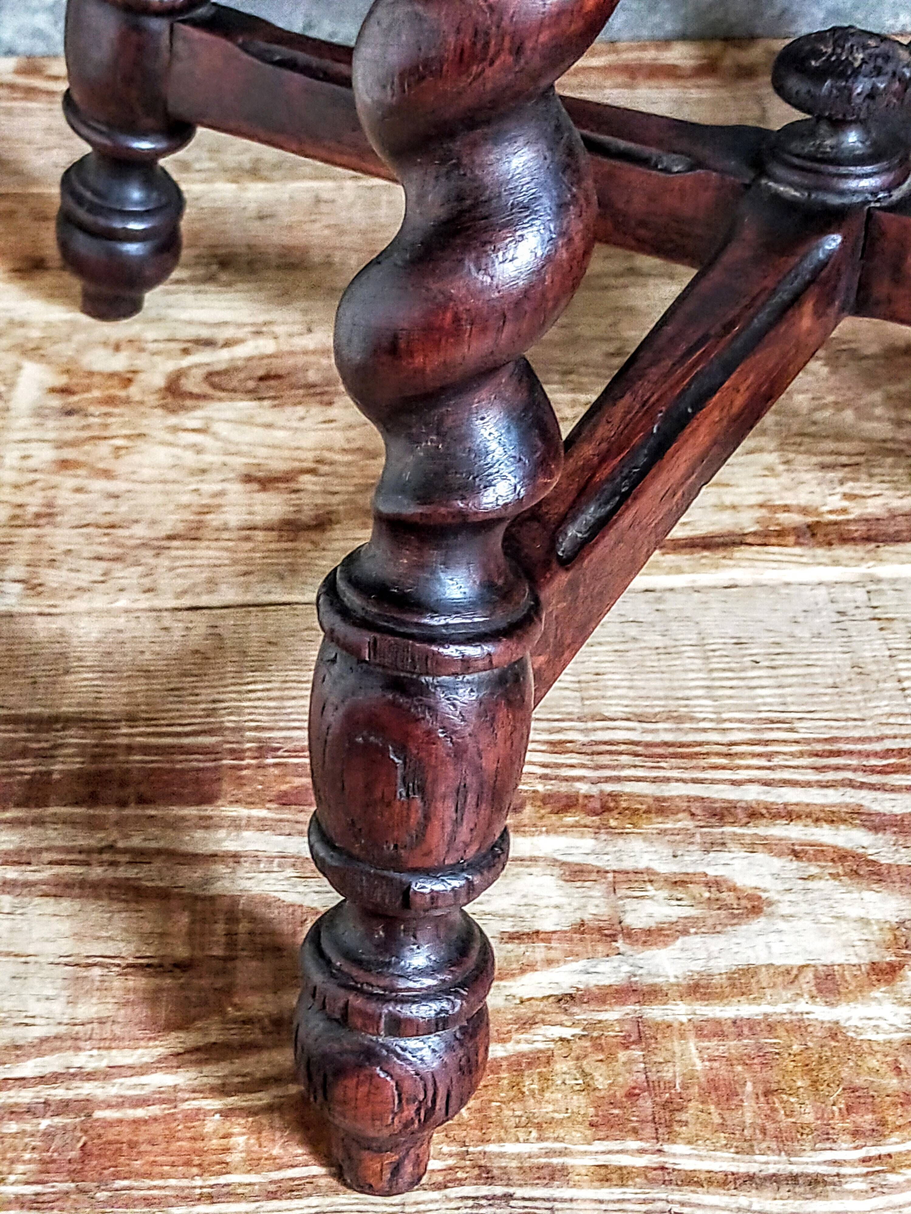 Antique stool in turned and carved solid wood