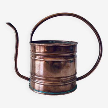 Old copper watering can