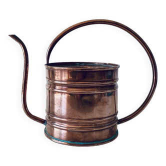 Old copper watering can