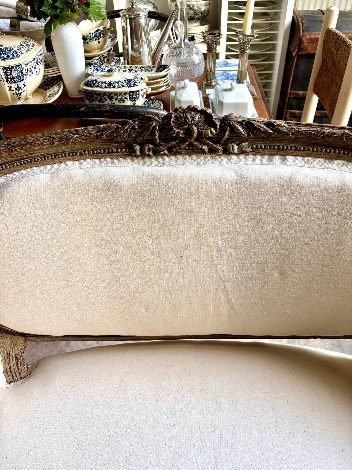Two-seater basket bench in carved wood and beige mixed fabric, 18th century.