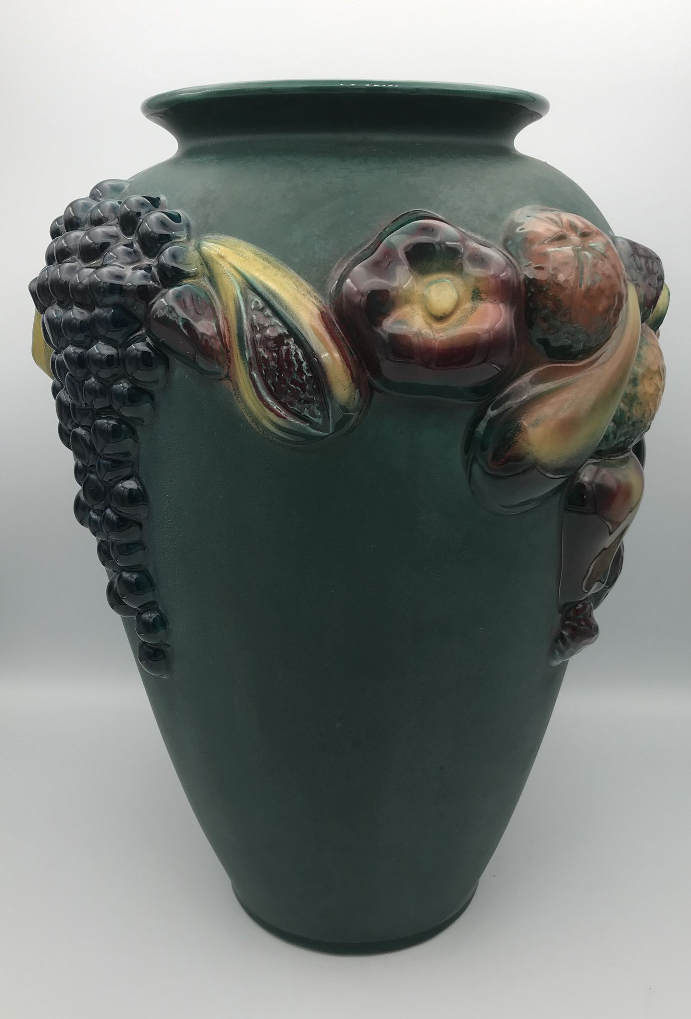 Green ceramic vase with polychrome decoration of fruits and vegetables in relief 33.5 cm