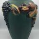 Green ceramic vase with polychrome decoration of fruits and vegetables in relief 33.5 cm