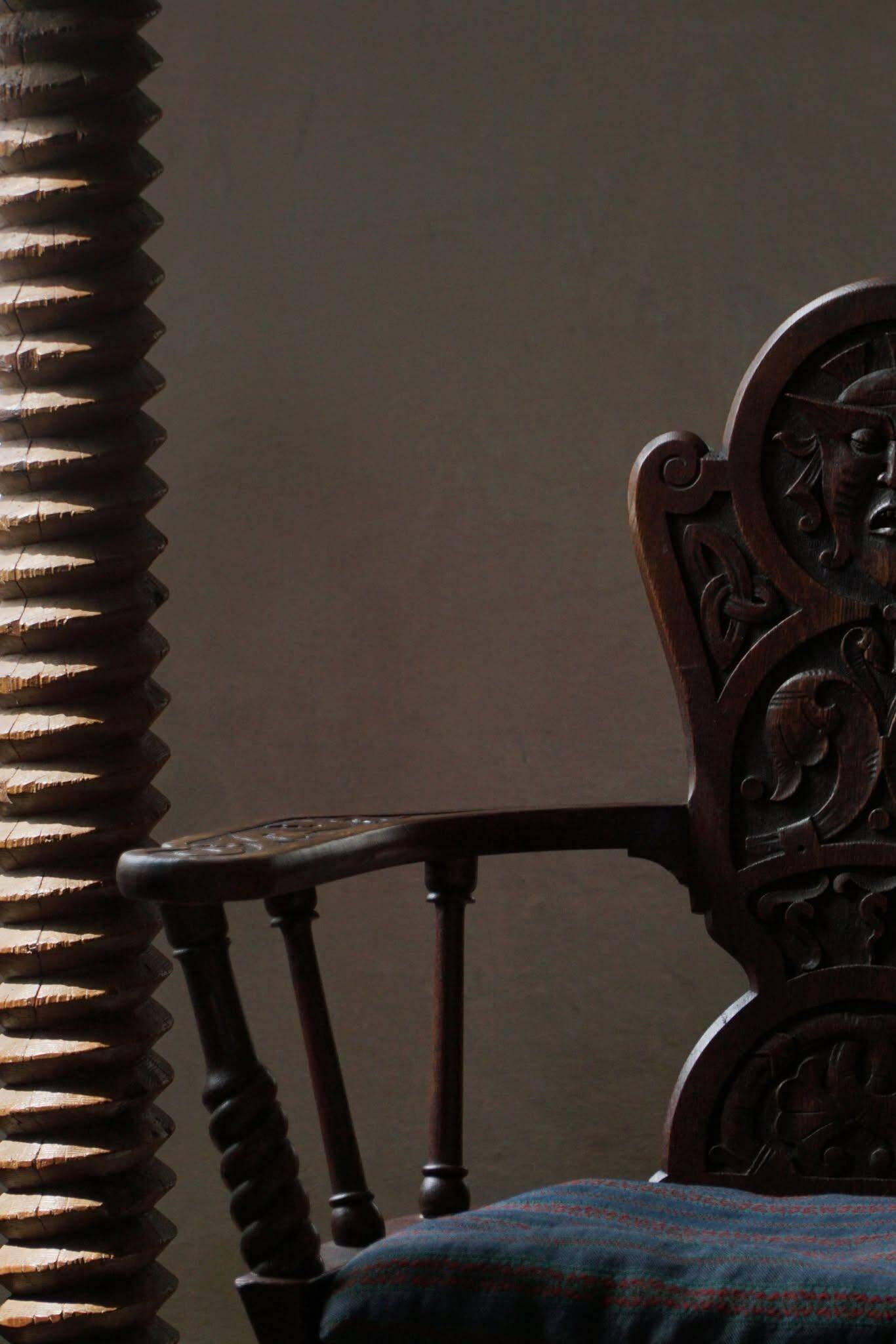 Scandinavian armchair in solid oak with cushion, folk art, early 19th century.