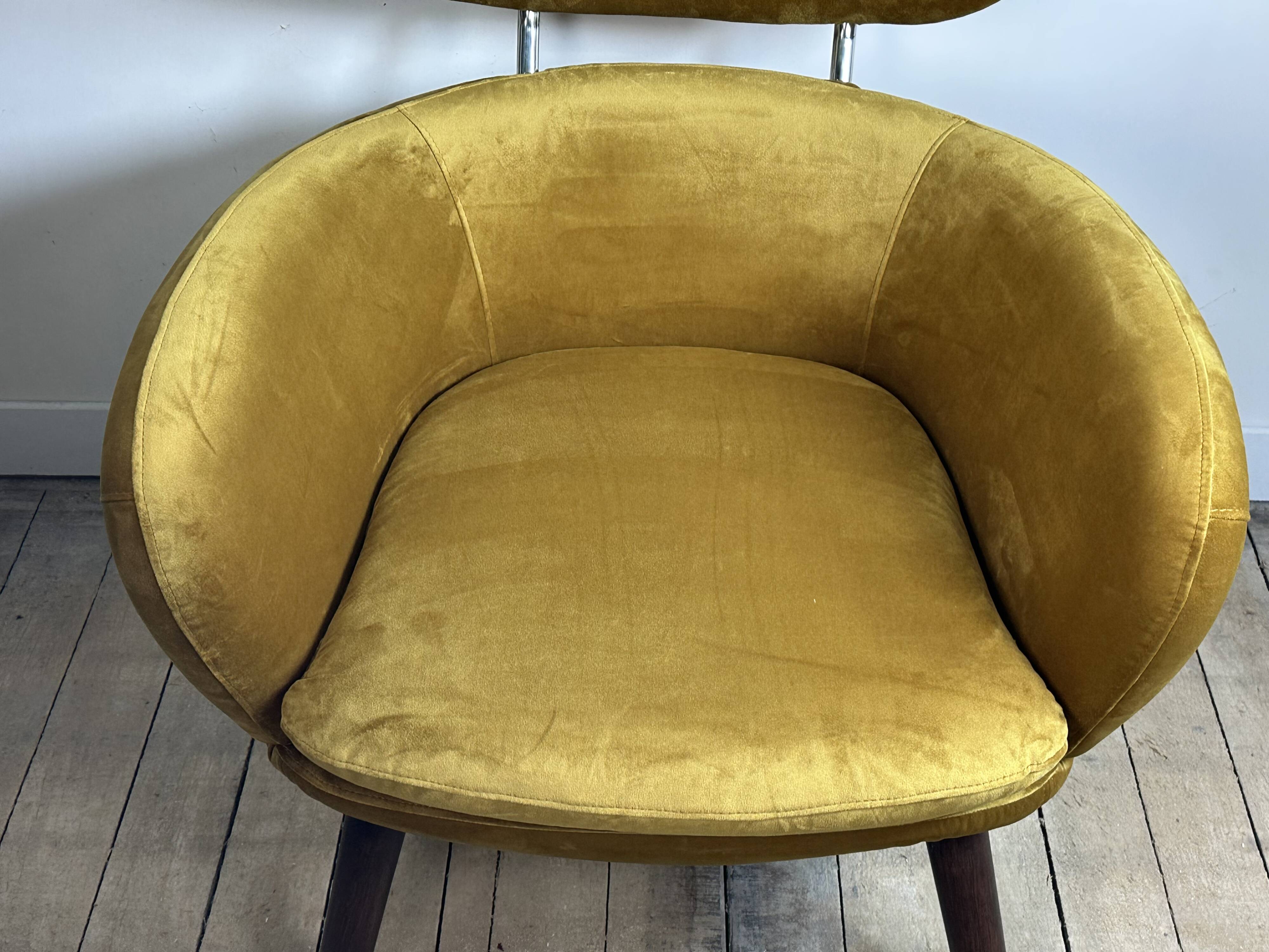 Mustard yellow velvet armchair from the 2010s.