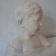 Bust young boy in plaster