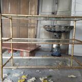 Console in gilded metal and glass