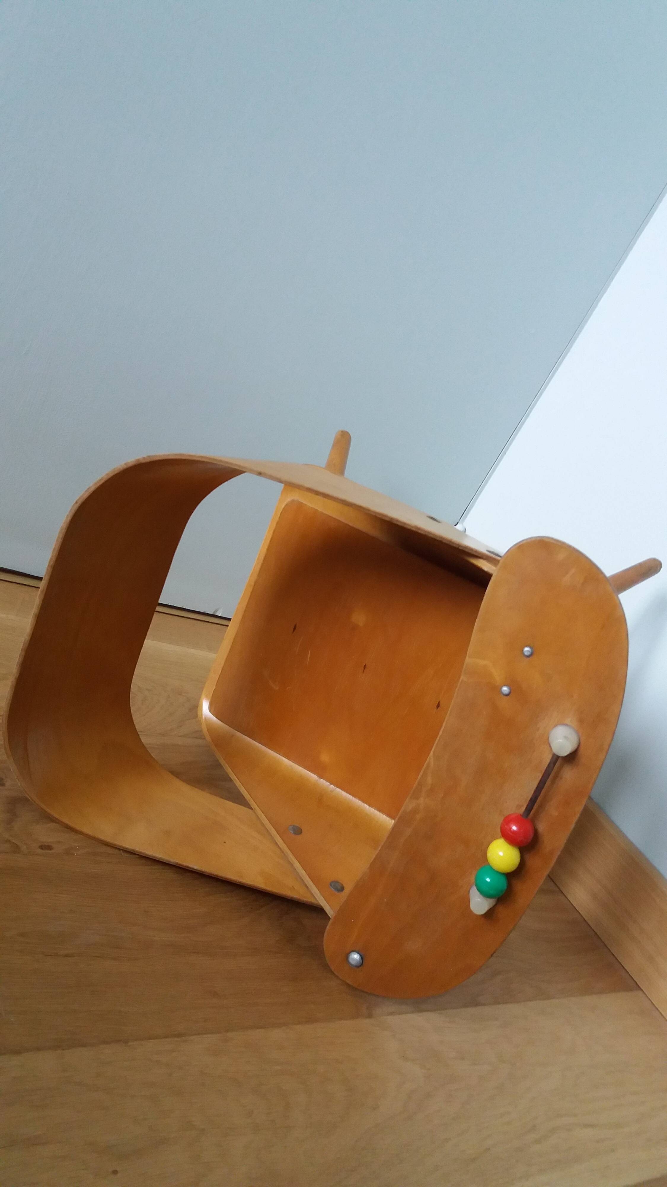 Baumann Baby Coquille children's armchair in bent wood with splayed legs.