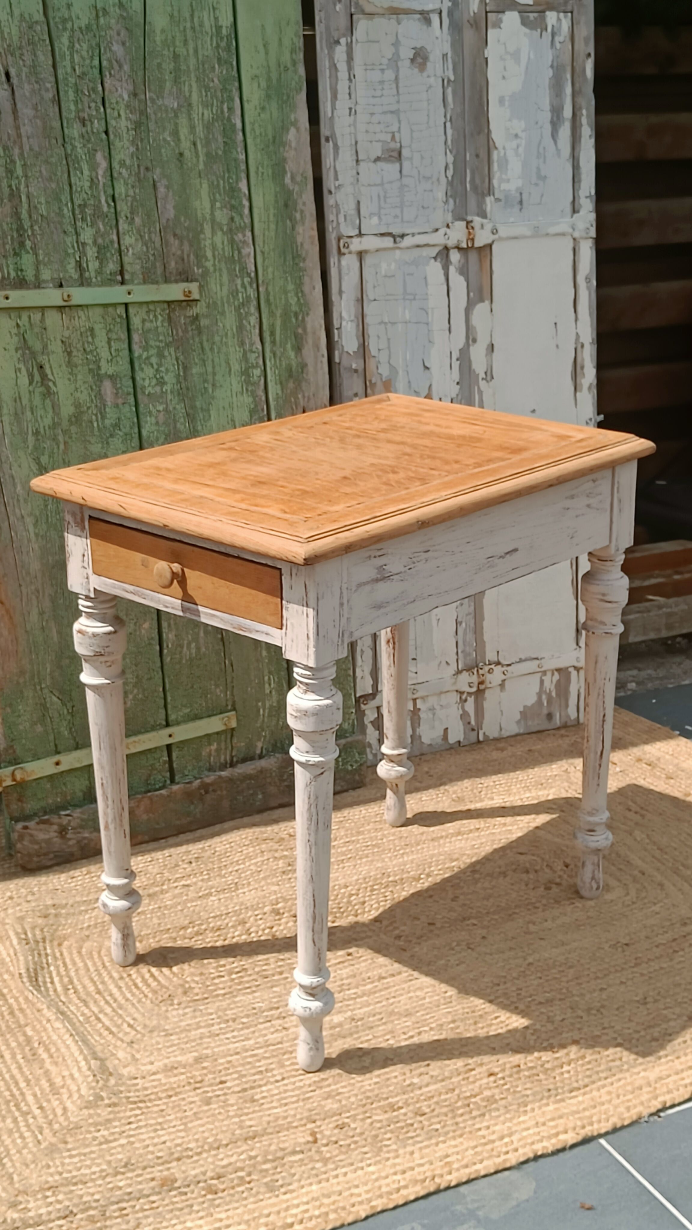 Antique drawer table with a patina.