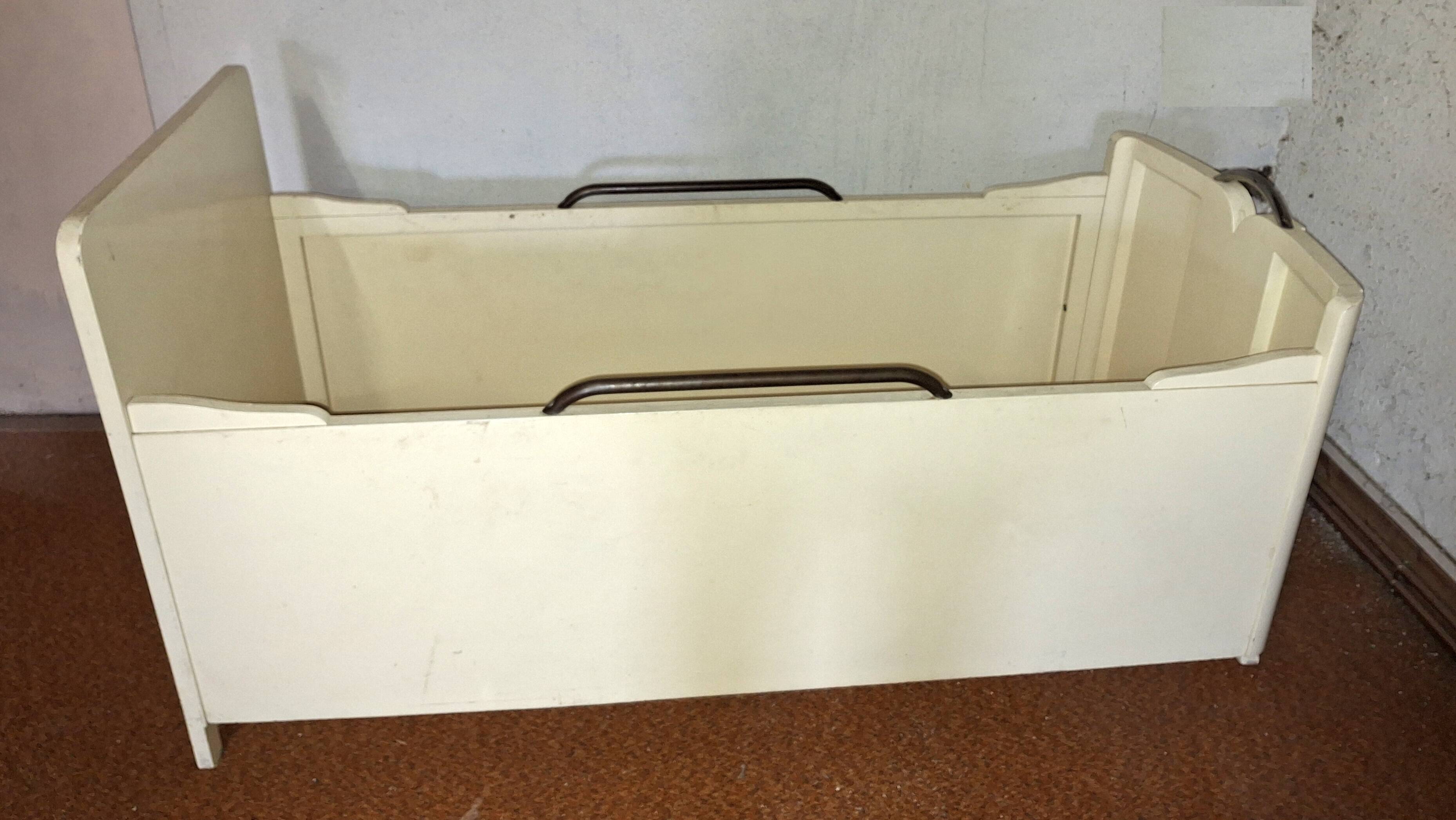 Painted wooden child's bed.