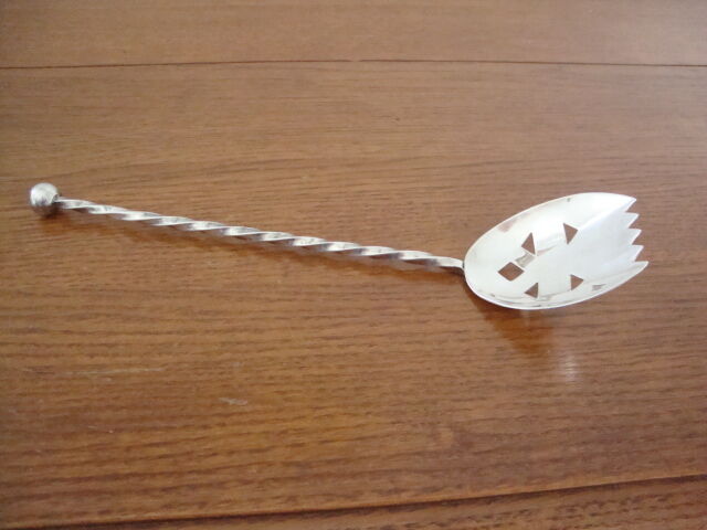 Silver metal sprinkling spoon