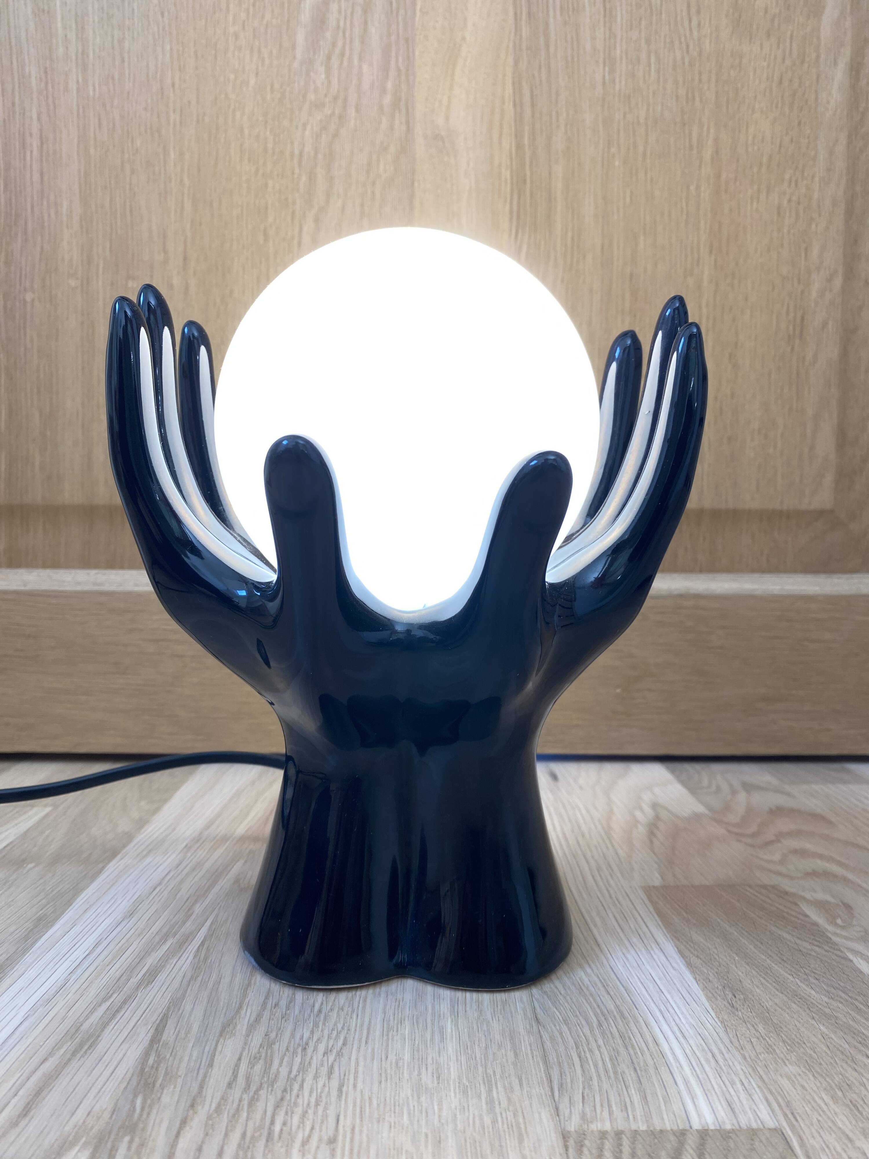 Sculpted ceramic globe lamp.