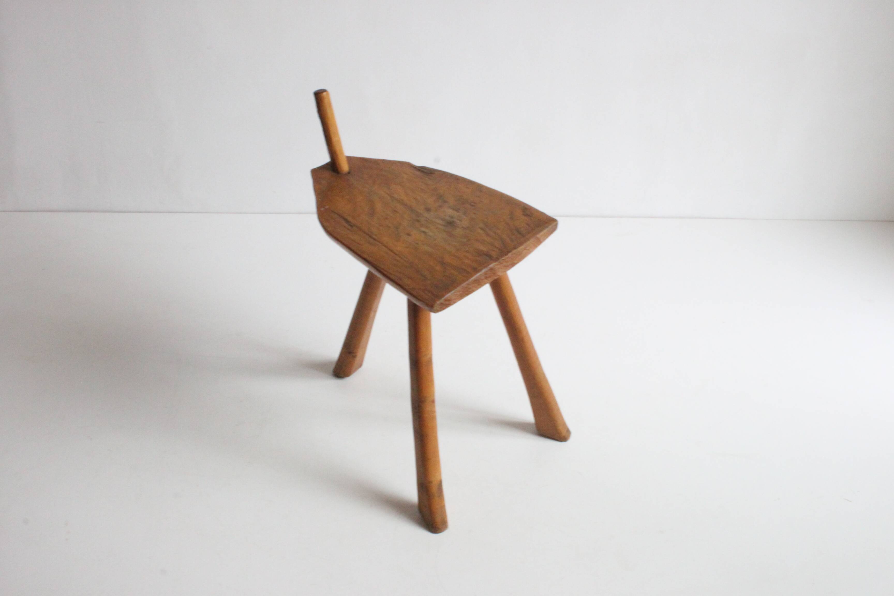 Brutalist tripod stool in carved wood, 1950s