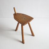 Brutalist tripod stool in carved wood, 1950s