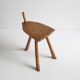 Brutalist tripod stool in carved wood, 1950s