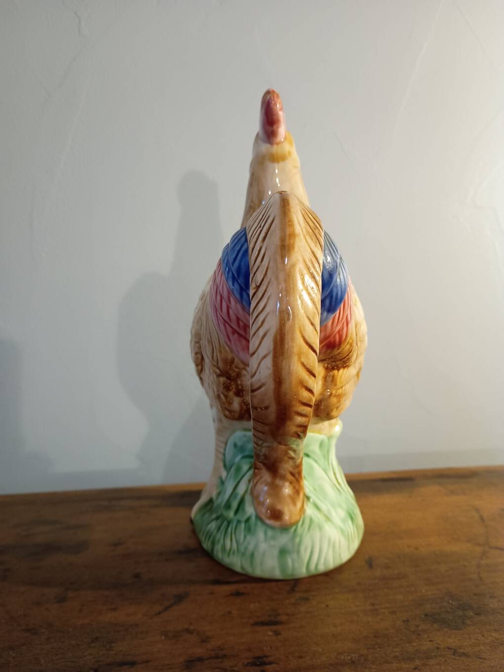 Vintage slipware jug in the shape of a rooster.