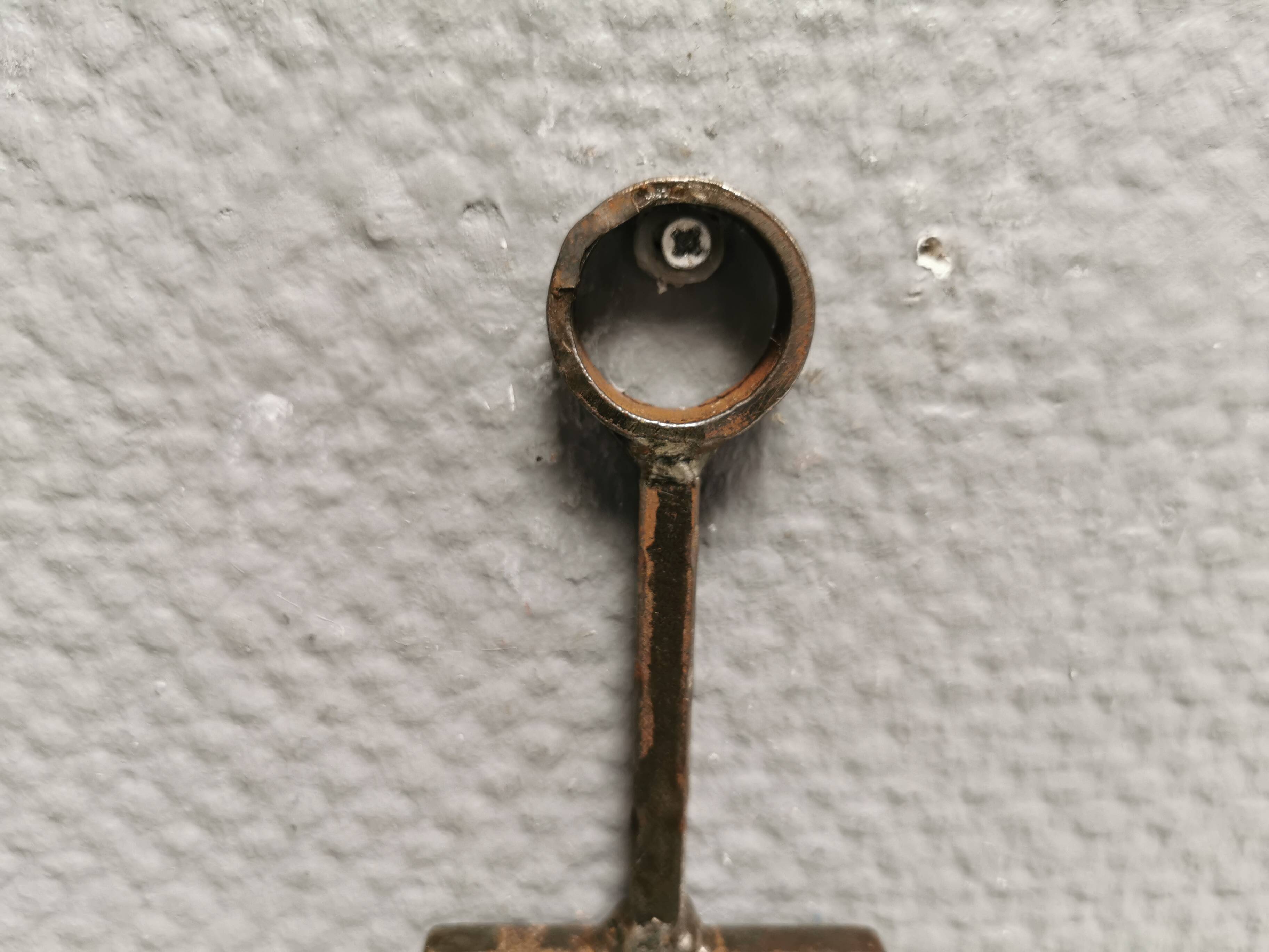 Wall-mounted candle holder in cast iron and hard pressed blue glass.