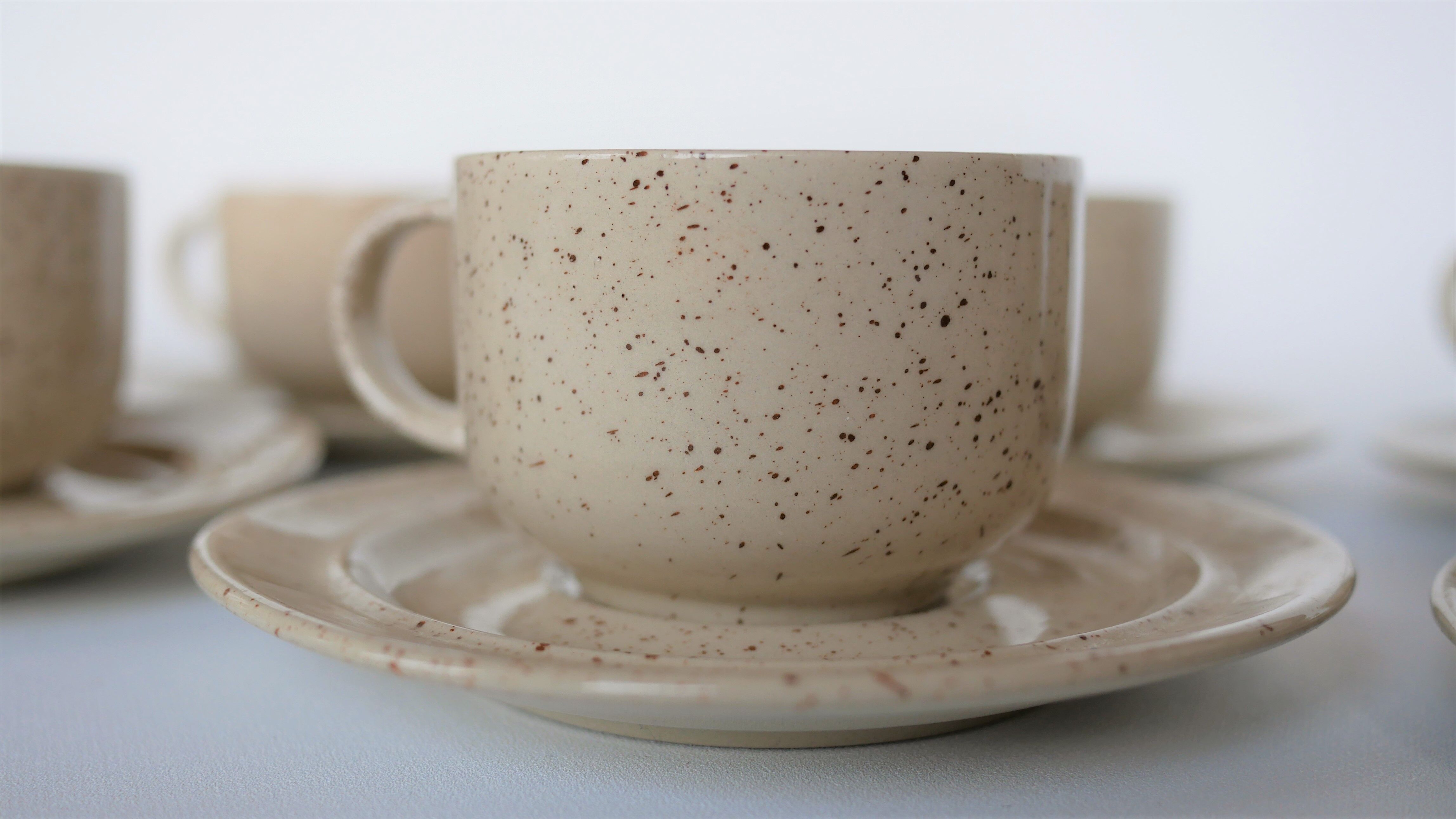 Coffee cup and vintage pyrity sandstone subcup