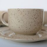 Coffee cup and vintage pyrity sandstone subcup