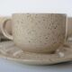 Coffee cup and vintage pyrity sandstone subcup