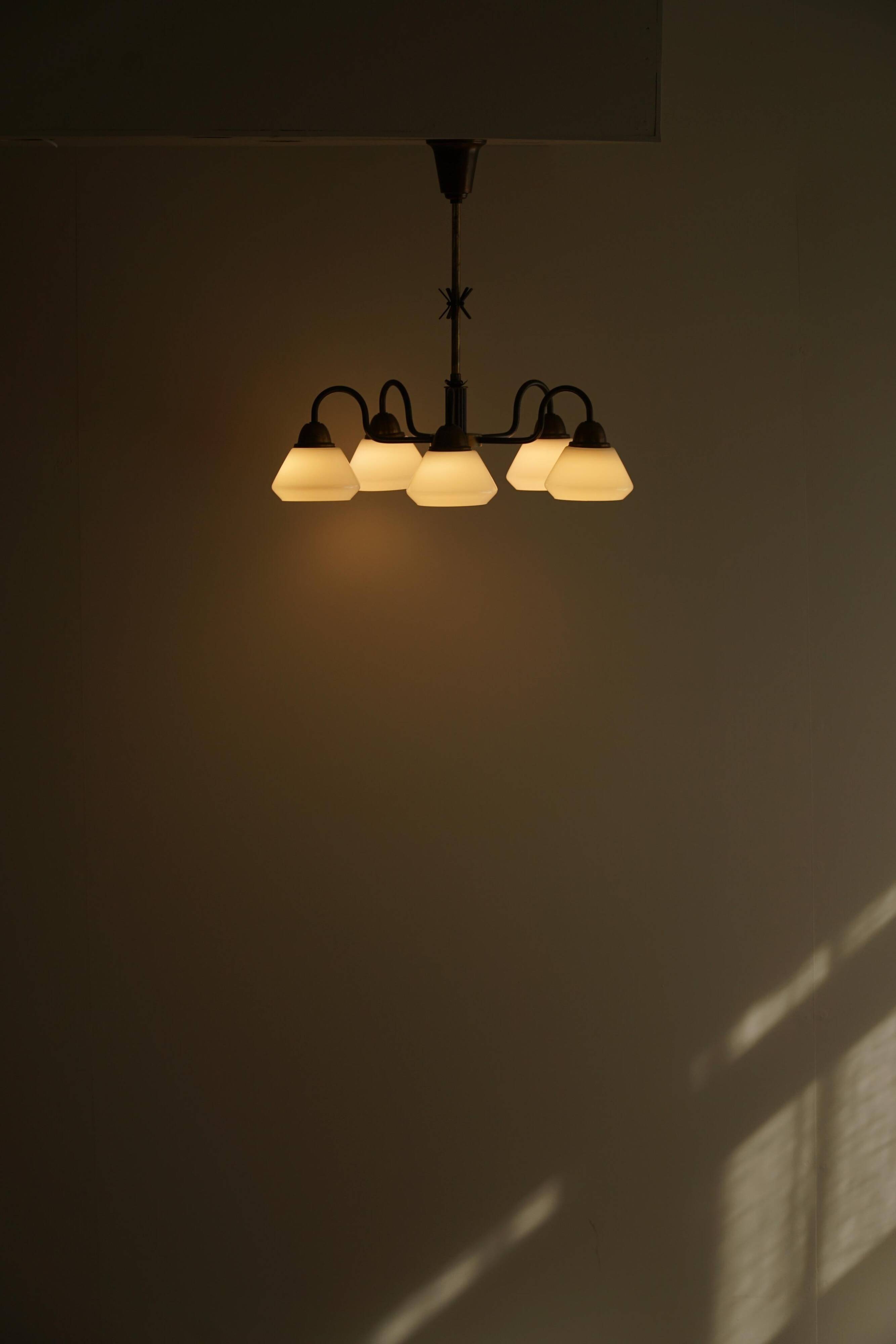 A modern Danish chandelier with 5 heads in opaline glass and brass, Art Deco, 1940s.