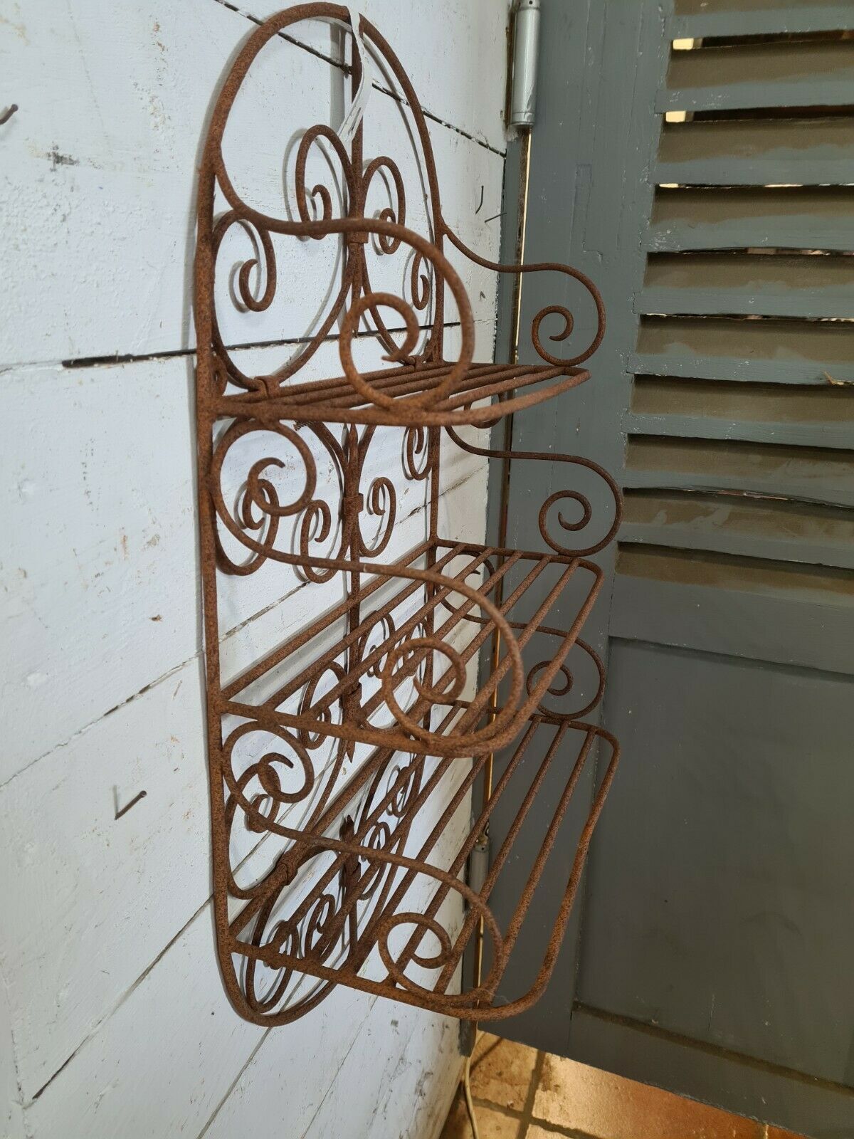 Wrought iron wall shelf