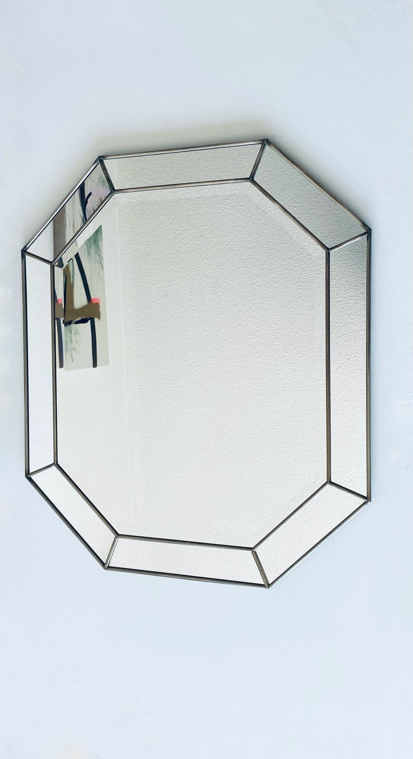 Old octagonal beveled mirror with parcloses