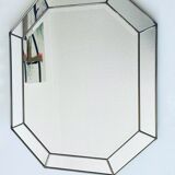 Old octagonal beveled mirror with parcloses