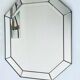 Old octagonal beveled mirror with parcloses