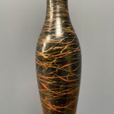 Black table lamp with paint splatters from the 1920s