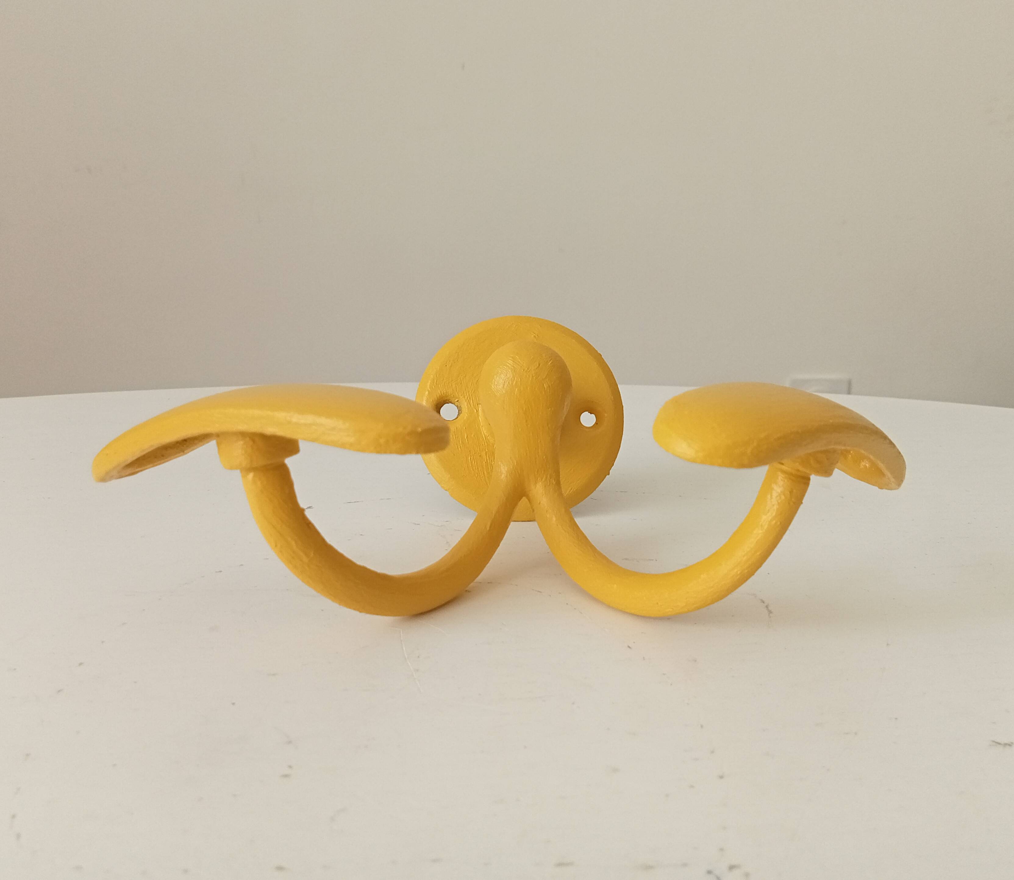 Vintage double coat rack in solid brass