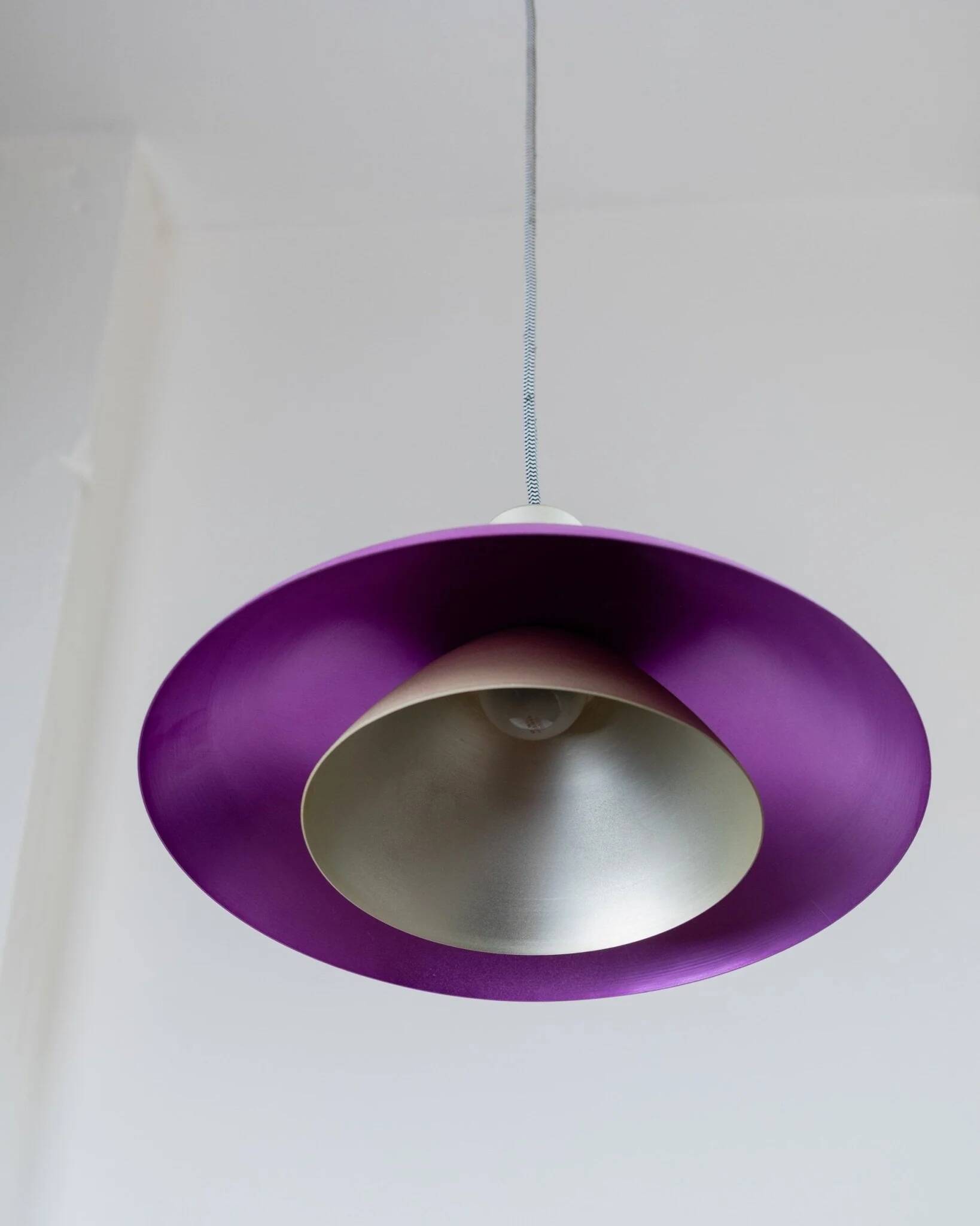 Vintage metal ceiling suspension – postmodern Memphis style from the 1980s, purple, green, silver, striped cable, Pop Art interior, retro light fixture.