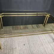 Vintage 1970s coffee table in gold metal and smoked glass.