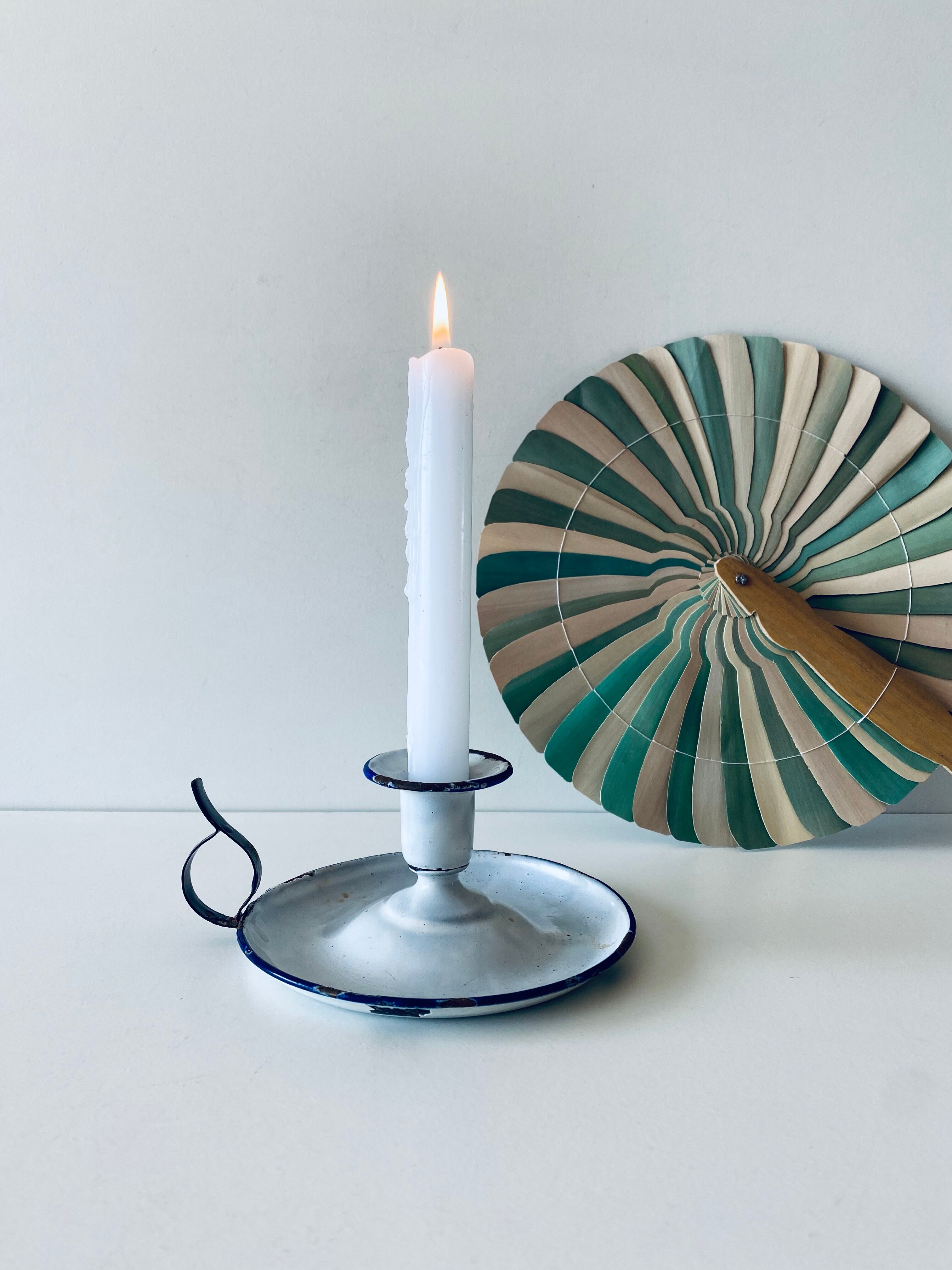 Antique candle holder in white and blue enamelled metal