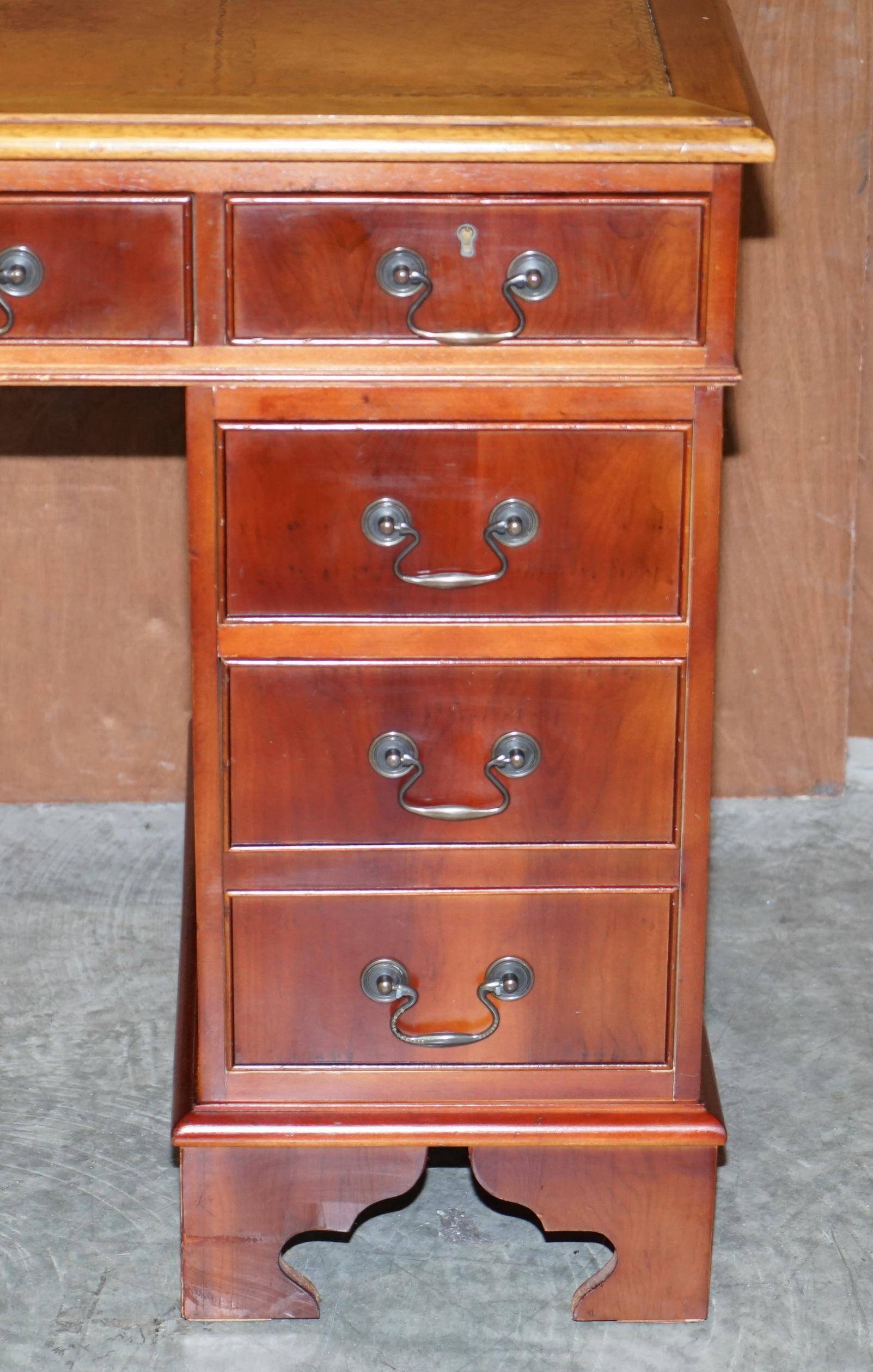 Vintage walnut desk with a leather top and two drawers.