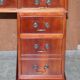 Vintage walnut desk with a leather top and two drawers.