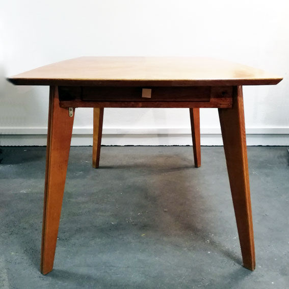 Dining table with compass feet