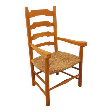 Vintage armchair in beech wood and straw from the 1950s.