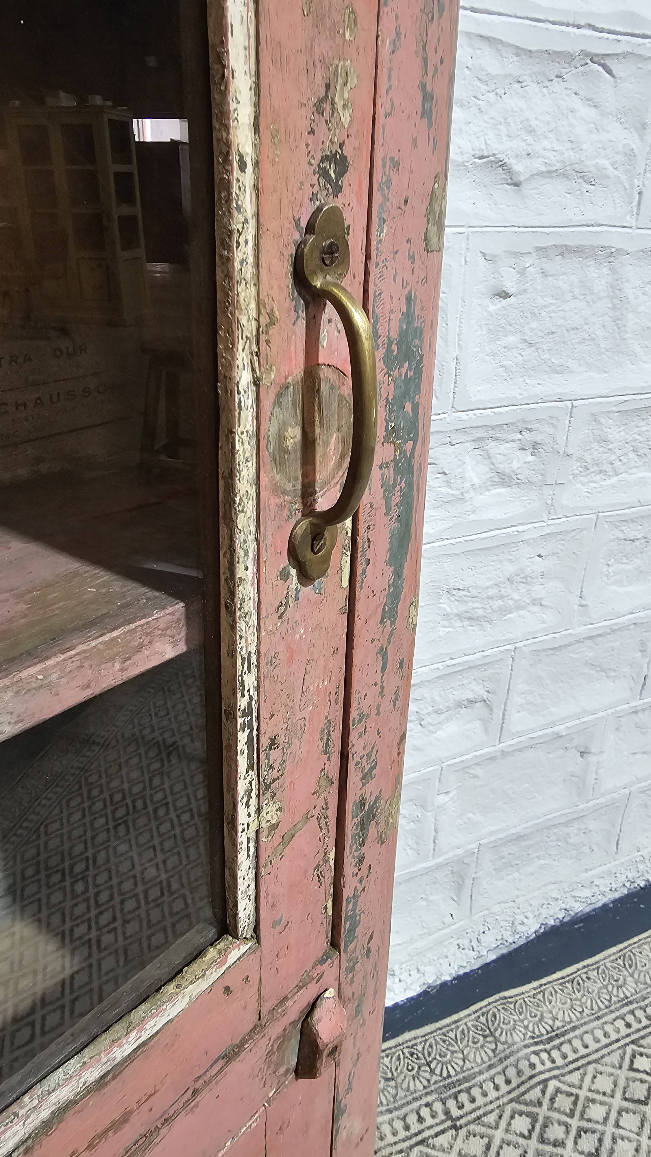 Pink showcase in Burmese teak