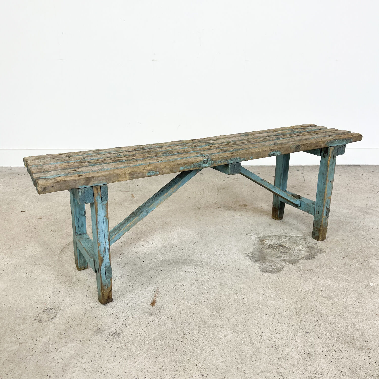 Light blue painted wooden farmhouse bench