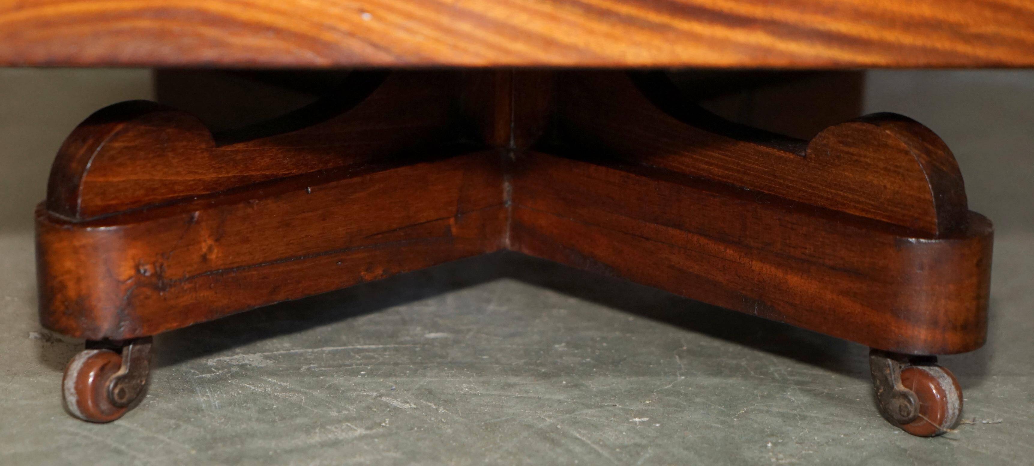 Sheraton-style rotating library table in walnut and satinwood.