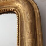 Old gilded mirror with A pediment