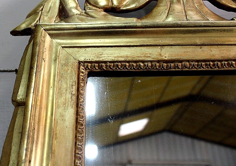 Miroir en bois doré, style Louis XVl, début XXe