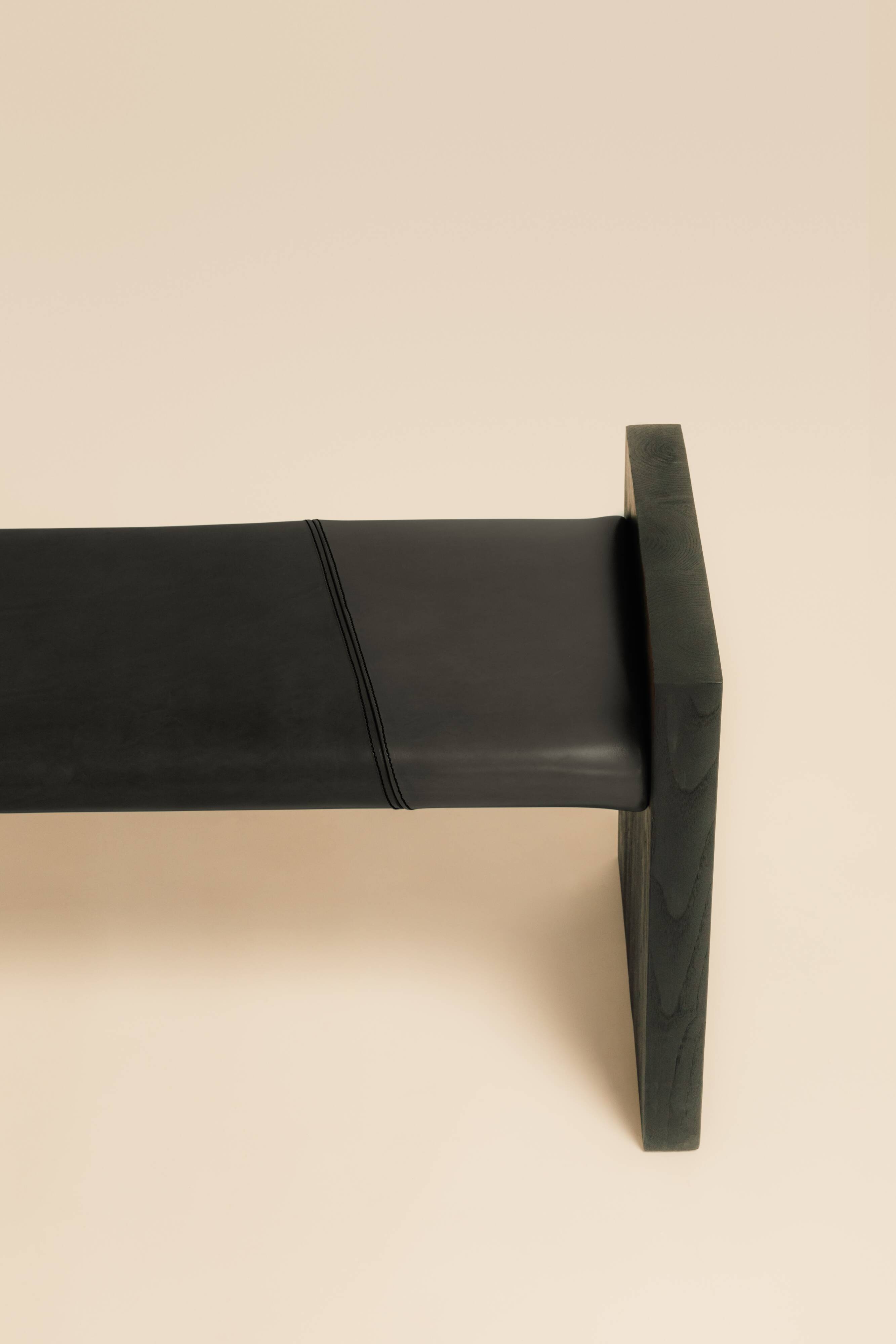 Maërl SEPIA bench, ebonized chestnut and black leather.
